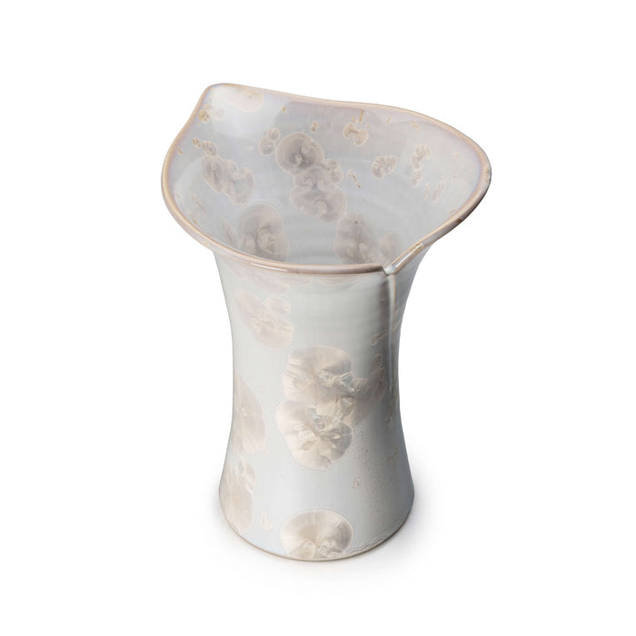 Clear crystalline vase with flared rim and embossed calla lily flower motifs throughout.