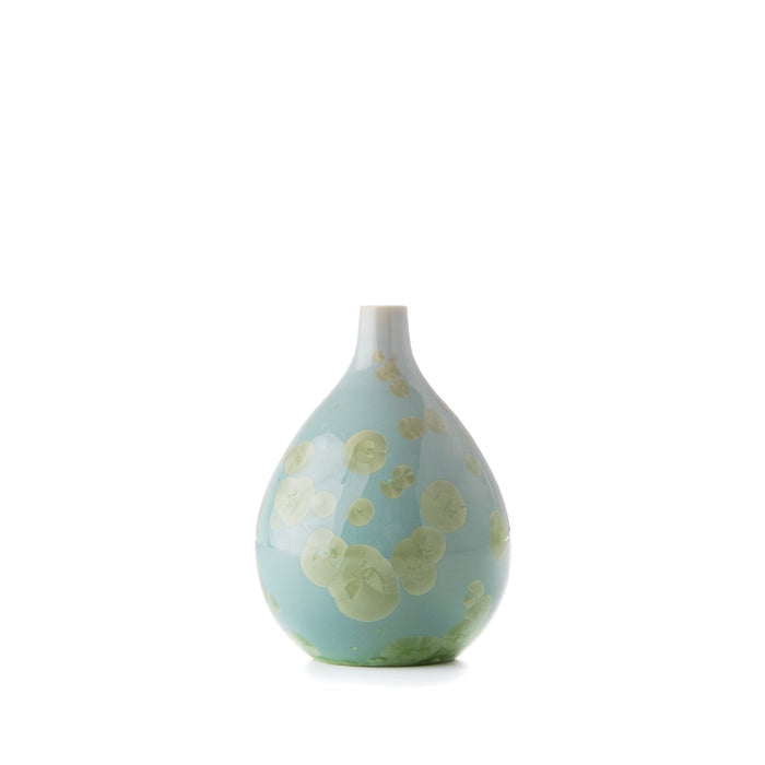 Teardrop-shaped ceramic vessel with light blue glaze and cream-colored crystalline inclusions throughout.