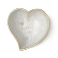 Small white heart-shaped bowl with twisted rim and crystalline texture interior.