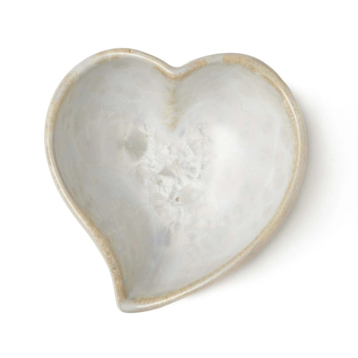 Small white heart-shaped bowl with twisted rim and crystalline texture interior.