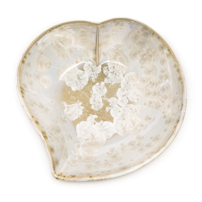 Clear glass heart-shaped bowl with white floral design and gold-toned leaf accents.