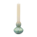Jade-colored crystalline candlestick with bulbous base holding a cream pillar candle.