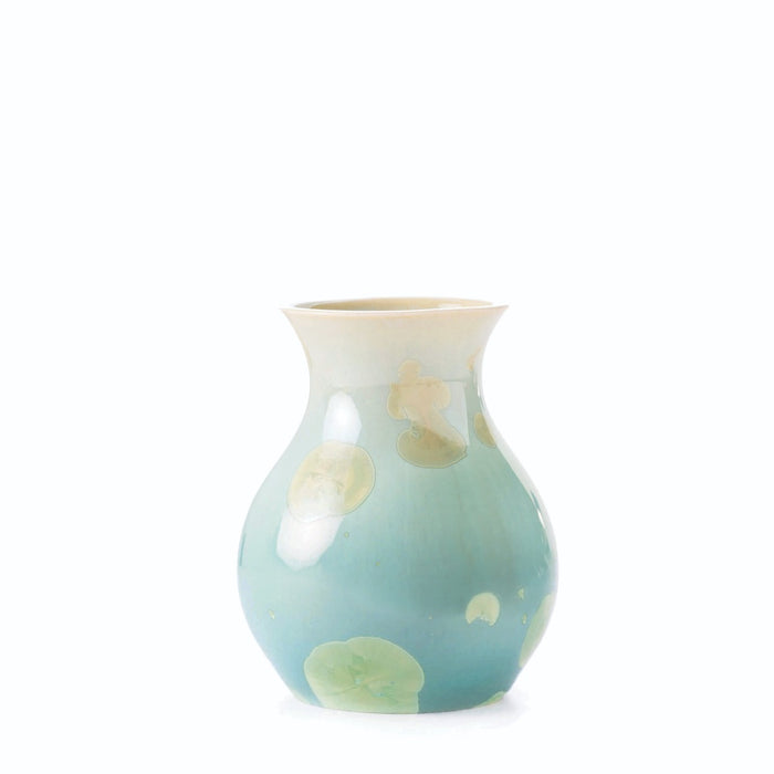 Small ceramic vase with bulbous body tapering to flared rim, featuring cream and pale green crystalline glaze with organic mo