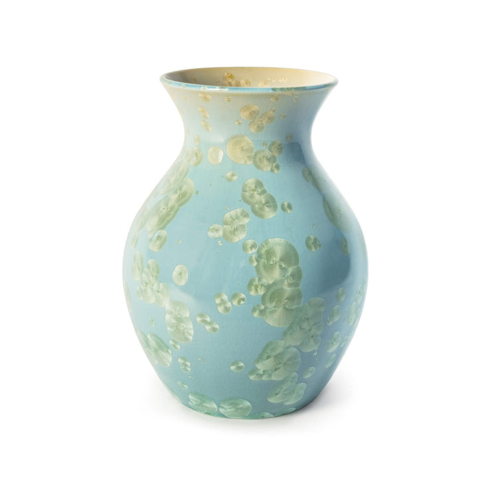 Light blue ceramic vase with cream and green crystalline pattern scattered across the bulbous body and flared neck.