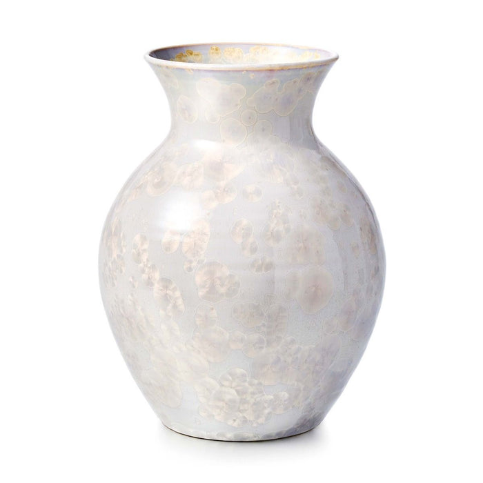 White ceramic vase with subtle floral pattern and gold-toned rim, bulbous body tapering to narrow neck.