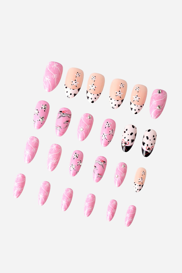 Dashing Dalmatian almond press-on nails with pink bows and Dalmatian print.