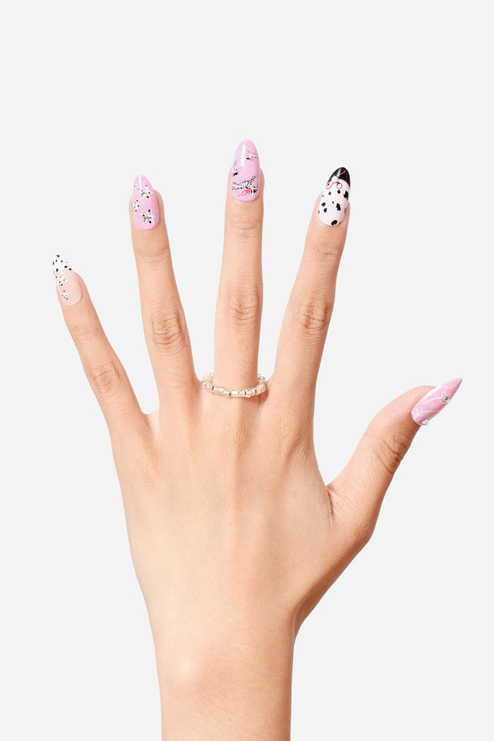 Dashing Dalmatian almond press-on nails with playful dog spots and bows.