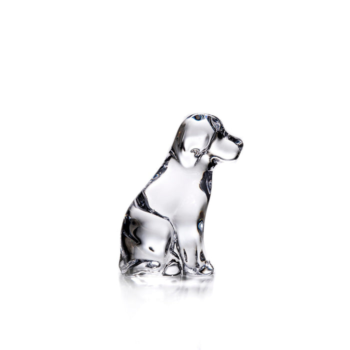 Clear glass dog figurine sitting upright with black detailing on head and body.