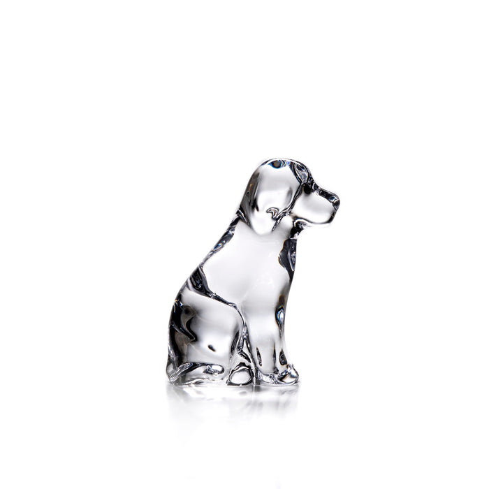 Clear glass dog figurine sitting upright with black accents on head and body.