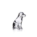 Clear glass dog figurine sitting upright with black accents on head and body.