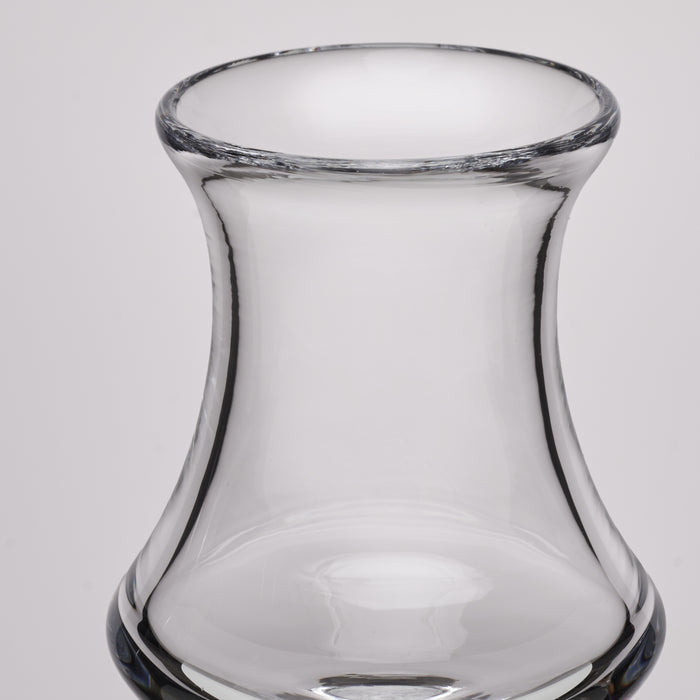 Clear glass aperitif glass with curved sides and wide rim.