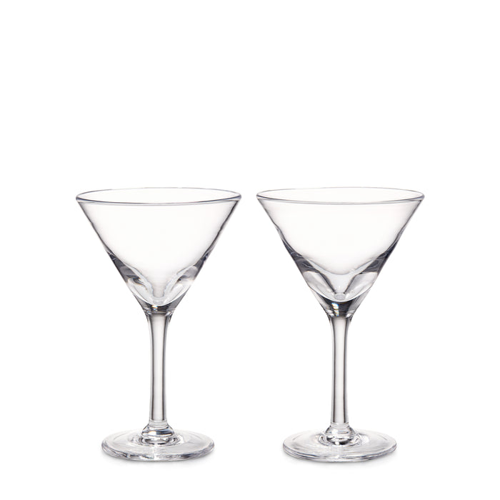 Two clear glass martini glasses with conical bowls and long stems on white background.
