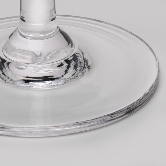 Clear glass martini glass with wide bowl and stem shown from above angle.