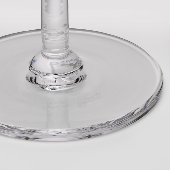 Clear glass coupe with wide shallow bowl and textured stem detail.