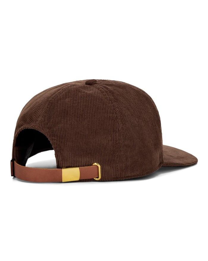 Brown corduroy cap with a gold buckle on a white background