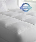 Down alternative mattress topper and mattress cushion on a bed, White