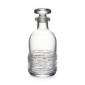 Clear glass decanter with textured lower body and matching stopper.