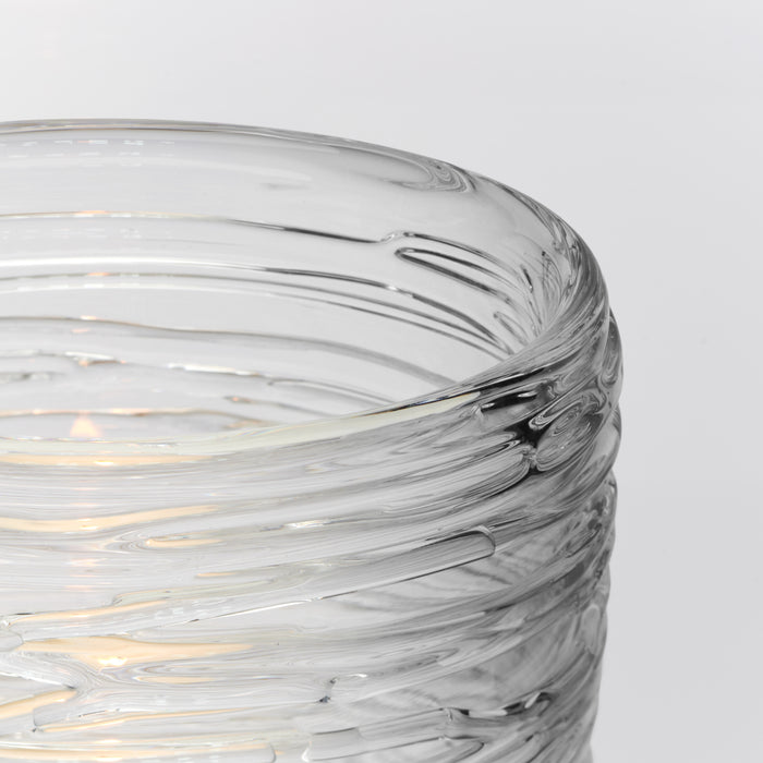 Clear glass hurricane with swirled grey and white pattern and textured ridged surface.