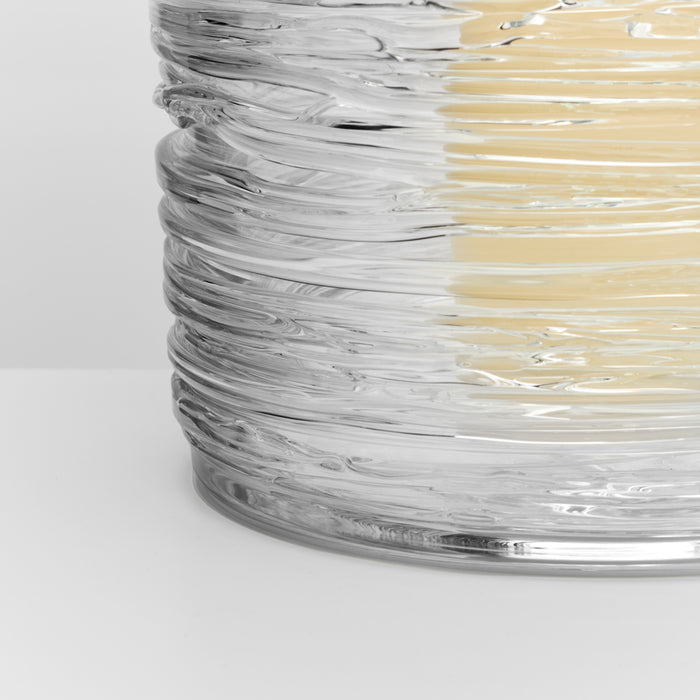 Clear glass hurricane with swirled texture pattern and cream-colored vertical stripes.