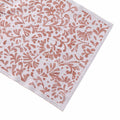 Cream and rust-colored runner with repeated floral leaf pattern throughout.
