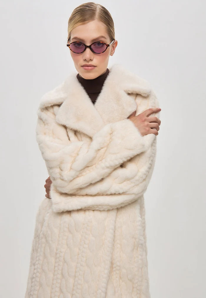 An elegant cream cable knit coat with faux fur trim, perfect for staying cozy and chic in the winter - introducing the stylish knit fur jacket, Faux Fur Coat Hildi.