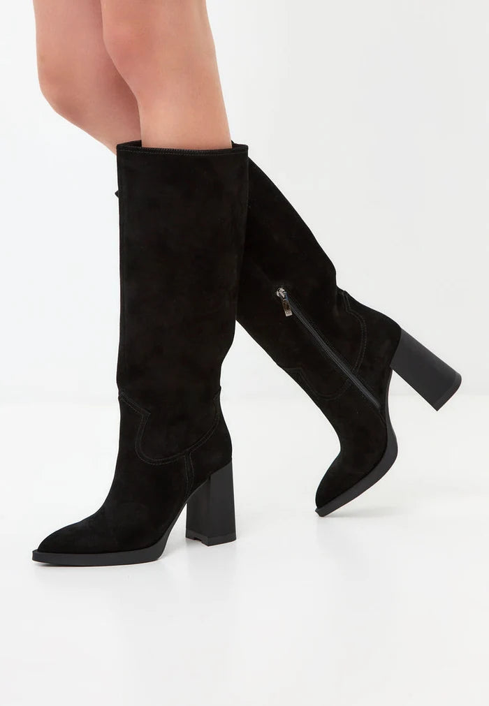 A pair of black knee-high block heel boots, beautifully crafted with elegant detailing, ideal for a chic and sophisticated look. These Bambi boots are a timeless addition to any wardrobe.