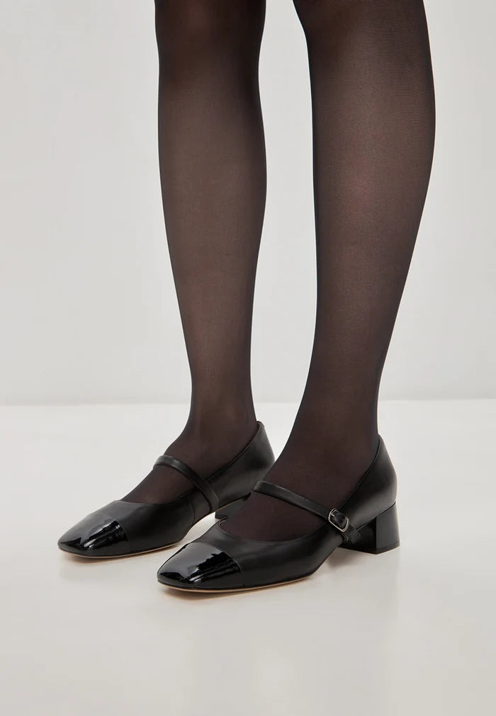 A pair of elegant black Mary Jane heels, showcasing classic style and sophistication with a hint of modern flair.