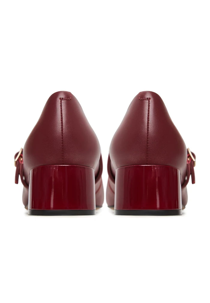 A pair of elegant red Mary Jane heels, perfect for women looking for stylish and sophisticated footwear.