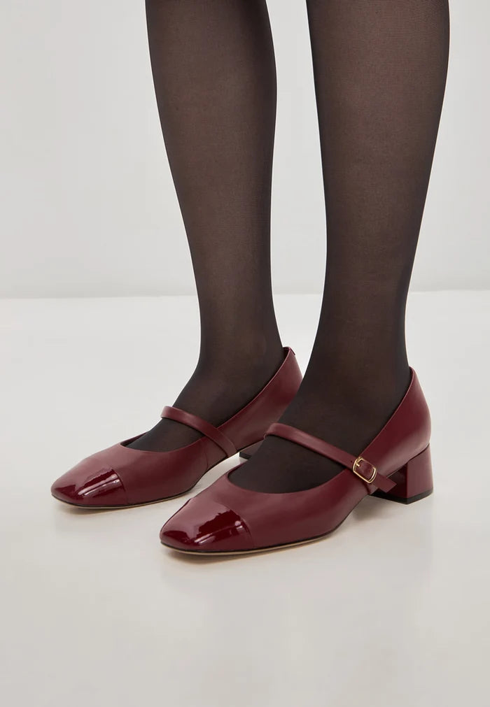 A pair of elegant red Mary Jane heels - perfect for women's fashion with a touch of sophistication and style.