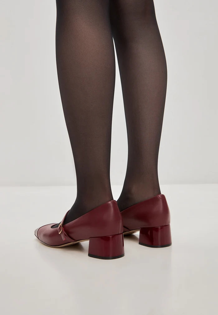 A pair of elegant red Mary Jane heels, ideal for women who love stylish and sophisticated pumps.