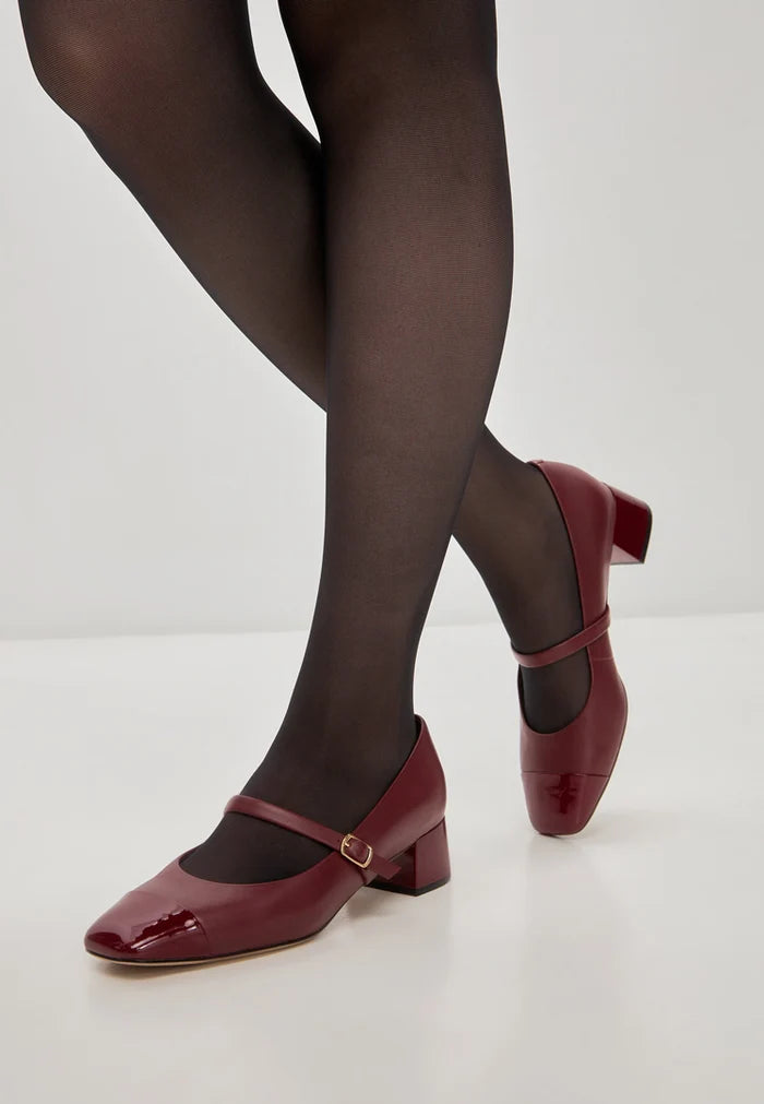 A pair of elegant red Mary Jane heels, perfect for any occasion.
