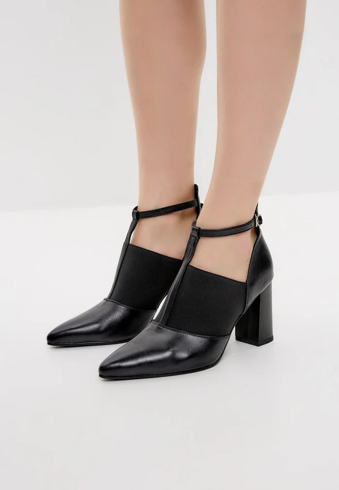 A stylish pair of women's block heel T-Strap elevated sandals, featuring chunky heel footwear perfect for a sophisticated and fashionable look.