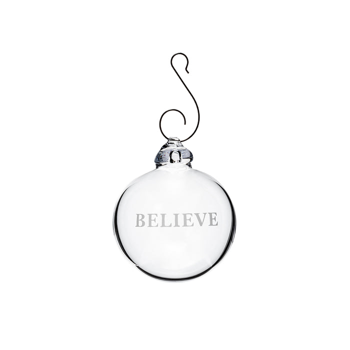 Clear glass round ornament with "BELIEVE" engraved on front and metal hook at top.