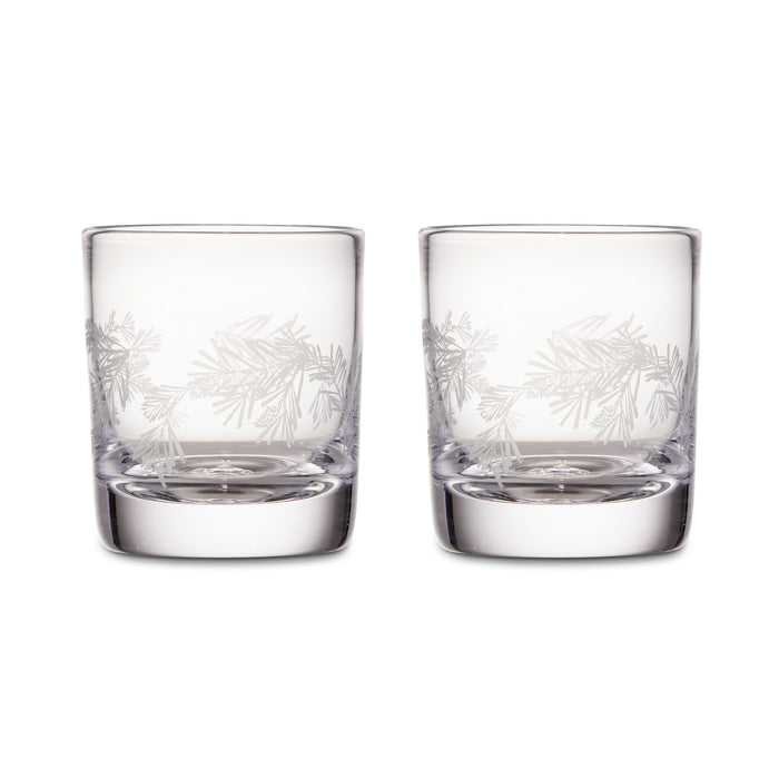 Two clear double old-fashioned glasses with engraved pine needle design around the upper portion.