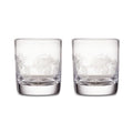 Two clear double old-fashioned glasses with engraved pine needle design around the upper portion.