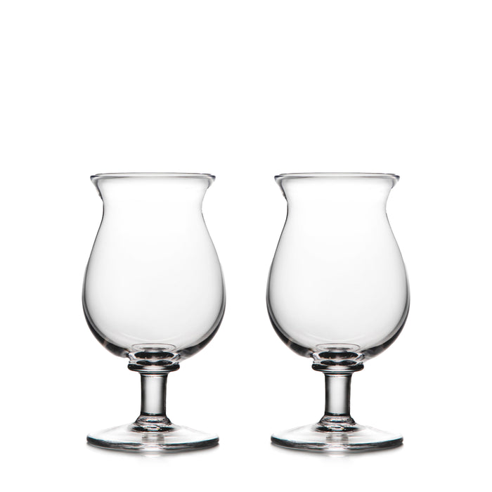 Two clear glass tulip-shaped stemmed glasses with rounded bowls and pedestal bases.