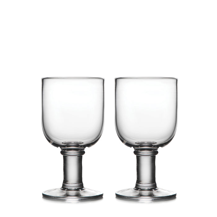 Two clear glass water glasses with pedestal bases and cylindrical bowls.