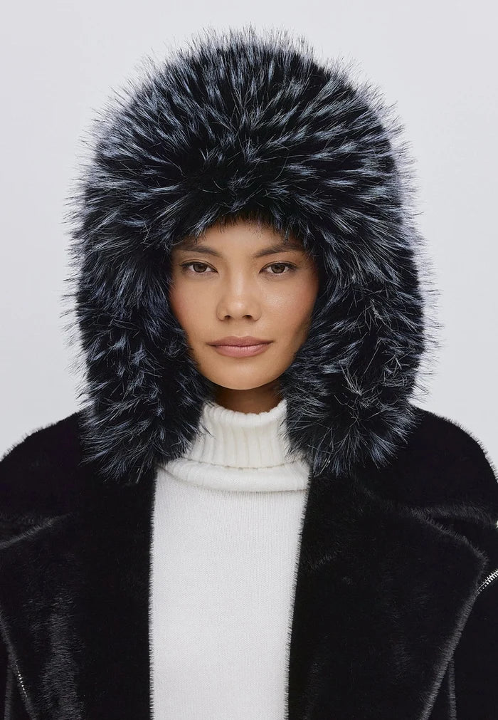 A stylish black faux fur hat for a trendy winter look