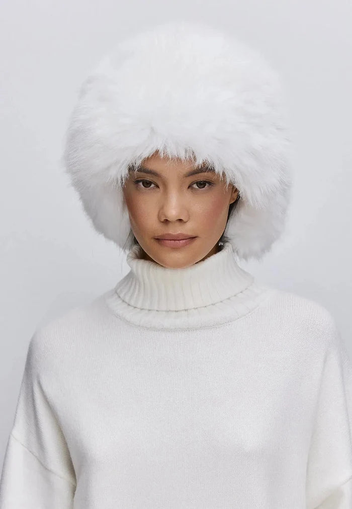Stay warm and stylish with this white faux fur hat - buy the perfect winter accessory now!