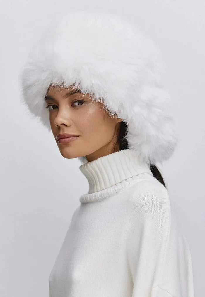 Stay warm and stylish this winter with a luxurious white faux fur hat - buy faux fur hat online now!