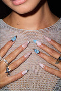 Fawning Over You almond press-on nails: pink, blue butterfly, white polka dots with gold accents.