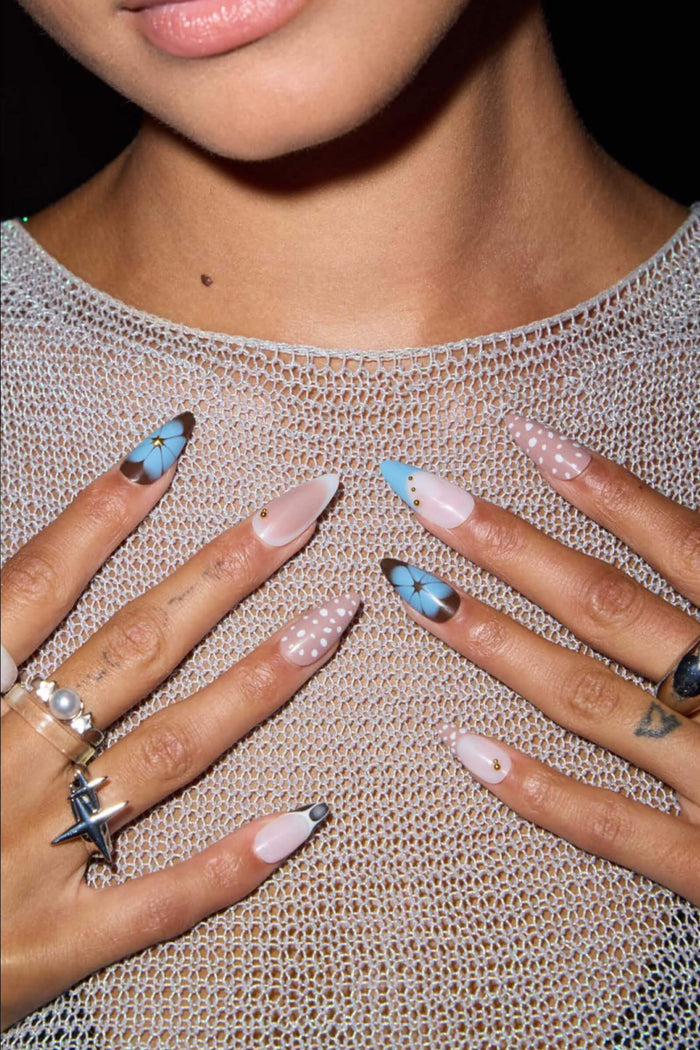 Fawning Over You almond press-on nails: pink, blue butterfly, white polka dots with gold accents.