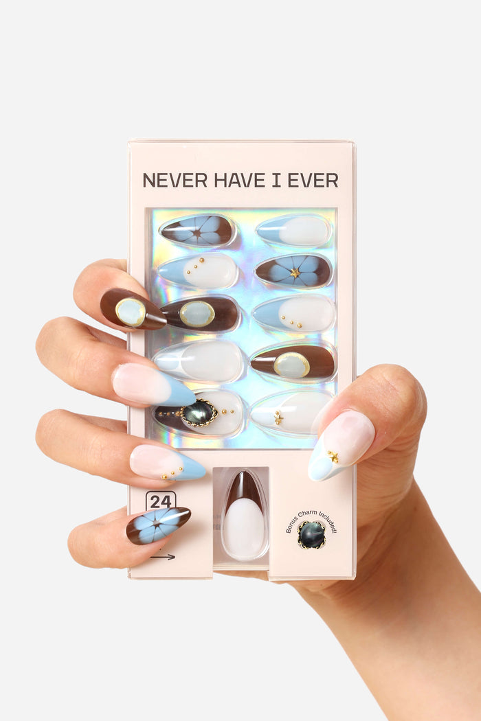 Fawning Over You almond press-on nails with blue, brown, and white designs.