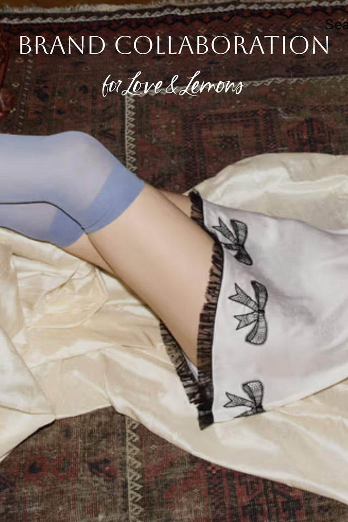 Brand collaboration with For Love & Lemons: almond press-on nails with floral bows and lace trim.