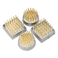 Four mini kenzans with brass pins in metal bases, two square and two round shapes.