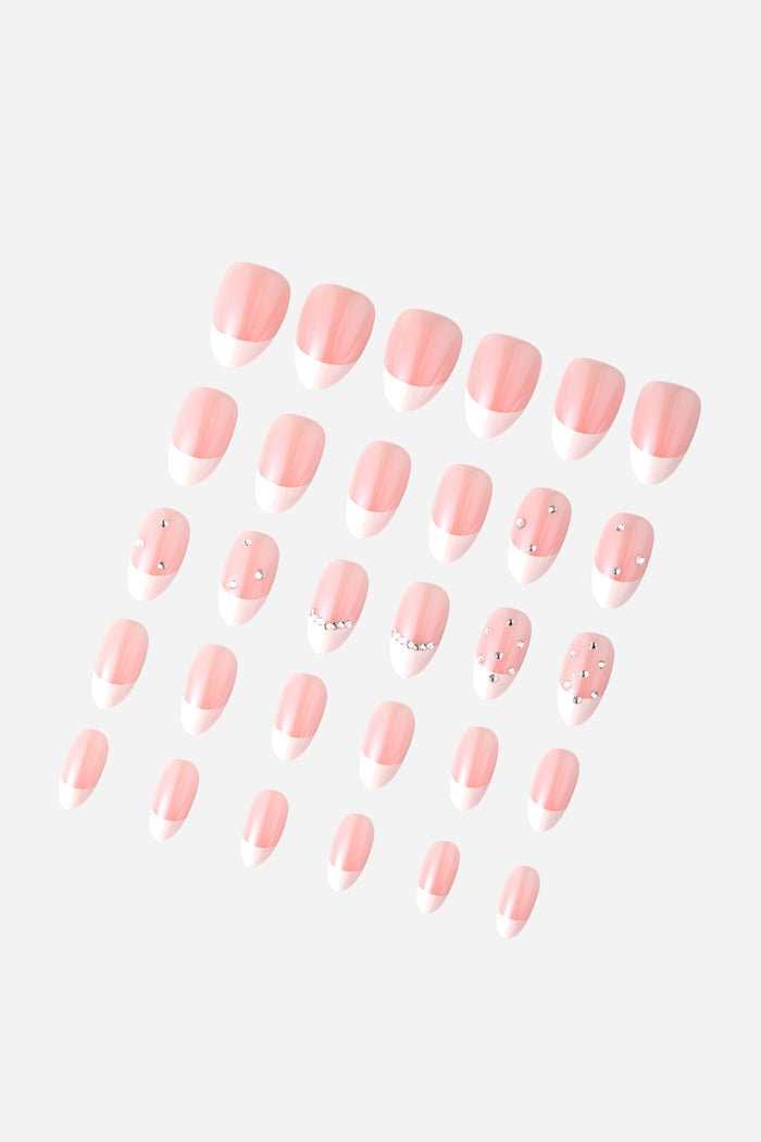 Short almond French tip press-on nails with rhinestone accents
