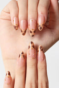 French tip press-on nails with leopard print accent and gold studs