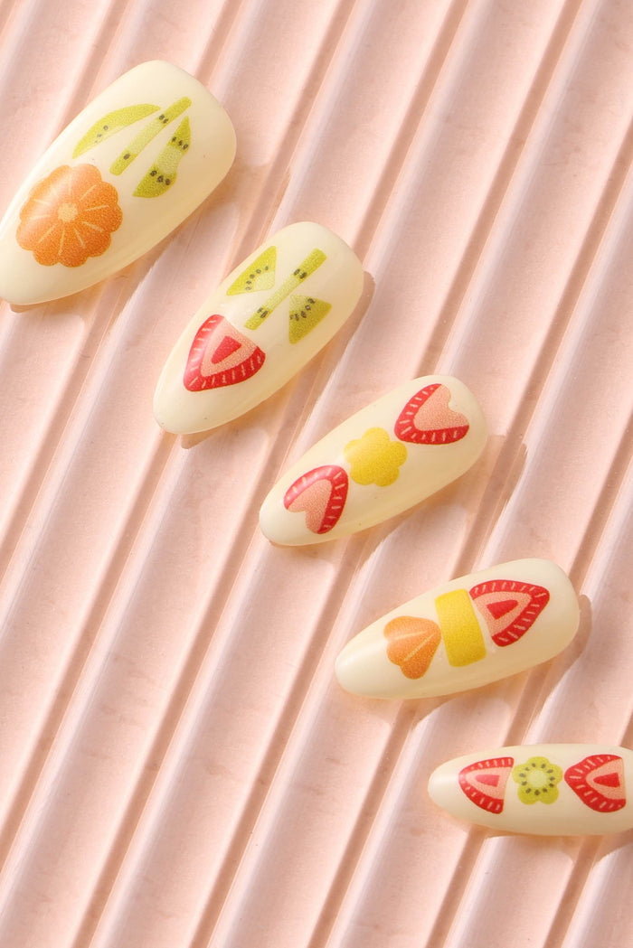 Fruit Sando press-on nails with strawberry, kiwi, and orange designs.