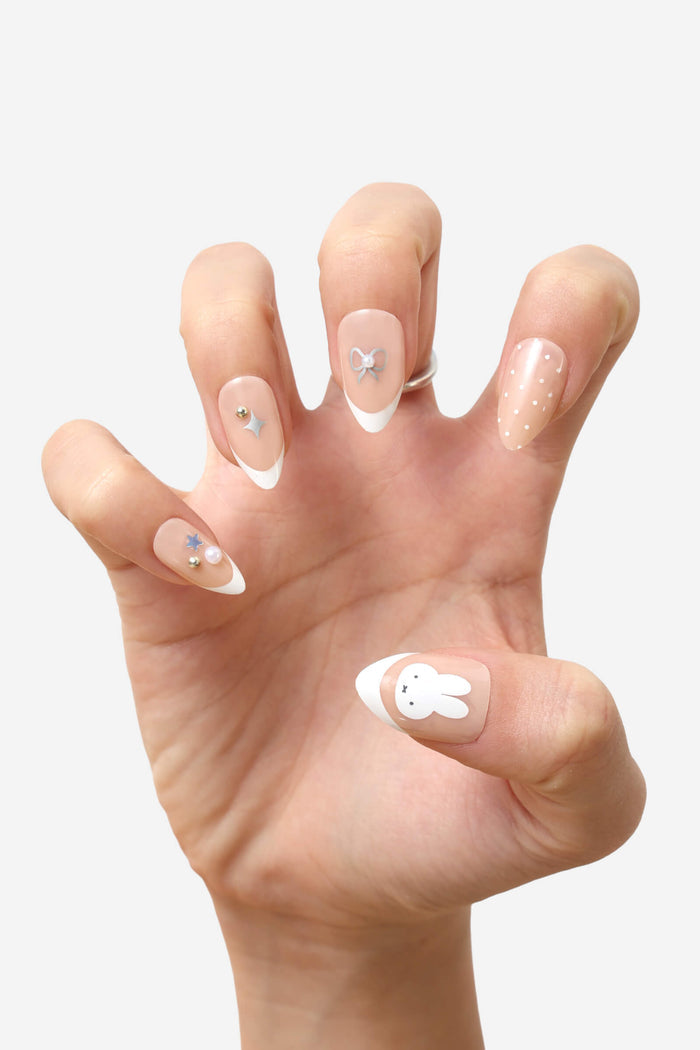 Miffy press-on nails in almond shape with French tip, polka dots, and cute Miffy character design.