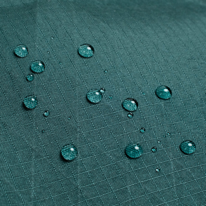 General shot of Topo Designs Global Pro Tech Case water droplets on waterproof material